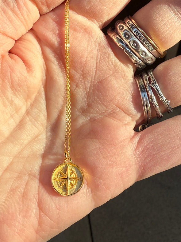 Gold compass necklace